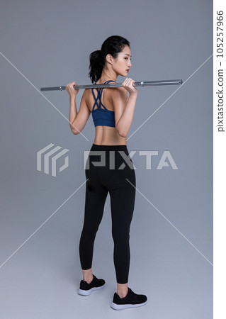 healthy beauty concept photo of korean asian beautiful woman with barbell healthy beauty concept photo of korean asian beautiful woman with barbell 105257966
