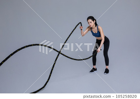 healthy beauty concept photo of korean asian beautiful woman with battling ropes healthy beauty concept photo of korean asian beautiful woman with battling ropes 105258020