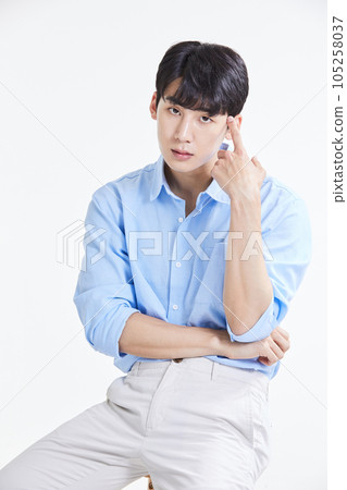 korean asian young man sitting on stool 105258037