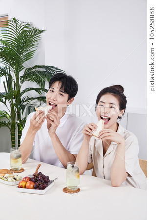 summer lifestyle, korean asian young couple having sandwich summer lifestyle, korean asian young couple having sandwich 105258038