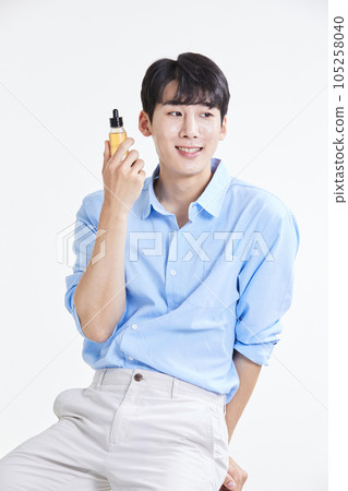 korean asian young man with skincare products 105258040