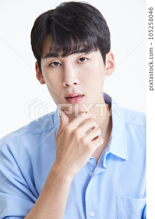 korean asian young man stroking his chin 105258046