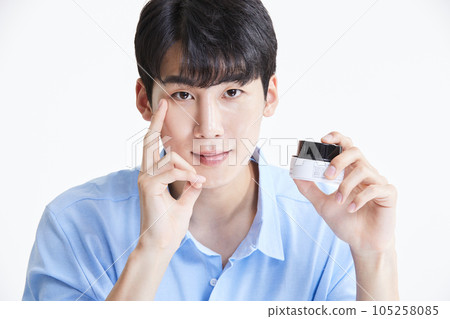korean asian young man applying cream 105258085