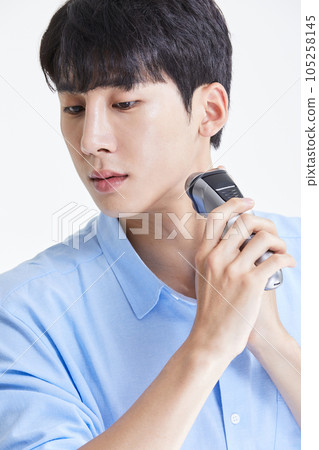 korean asian young man with razor korean asian young man with razor 105258145