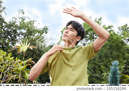 summer lifestyle, korean asian young man and shield the sun 105258284