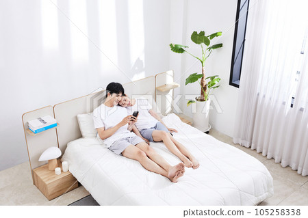 summer lifestyle, korean asian young couple with bed 105258338