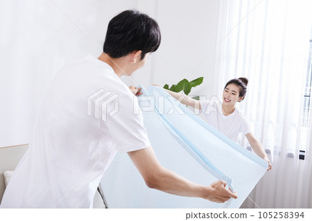 summer lifestyle, korean asian young couple making bed 105258394
