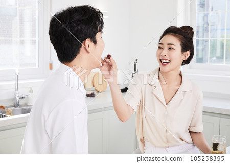 summer lifestyle, korean asian young couple feeding each other fruit 105258395