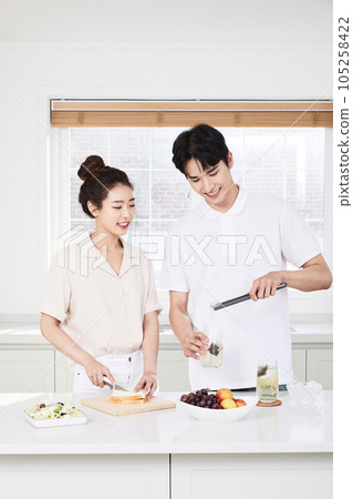 summer lifestyle, korean asian young couple cooking in kitchen 105258422