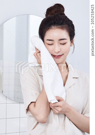 summer lifestyle, korean asian young woman drying face with a towel summer lifestyle, korean asian young woman drying face with a towel 105258425