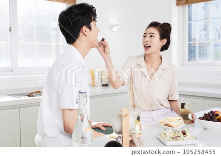 summer lifestyle, korean asian young couple feeding each other fruit 105258435