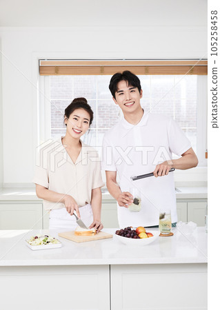 summer lifestyle, korean asian young couple cooking in kitchen summer lifestyle, korean asian young couple cooking in kitchen 105258458