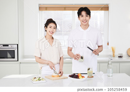 summer lifestyle, korean asian young couple cooking in kitchen 105258459