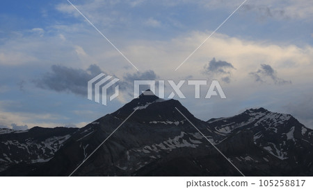 Sun lit clouds over the Les Diablerets range. 105258817