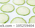 sliced cucumbers in a row 105259404