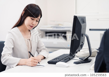 A woman preparing for a funeral at a company 105259563
