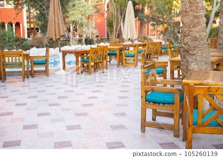 A restaurant and beautiful architecture on the territory of a castle in Egypt is the concept of a luxury trip. Rest on the territory of the hotel. 105260139