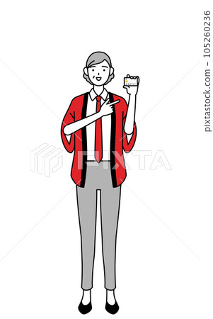 A senior female salesperson wearing a red happi coat recommending credit card payment A senior female salesperson wearing a red happi coat recommending credit card payment 105260236