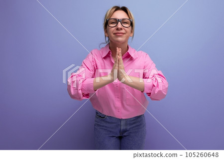 european smart successful young blond businesswoman in pink shirt and jeans gesturing on studio european smart successful young blond businesswoman in pink shirt and jeans gesturing on studio 105260648