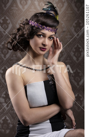 Retro woman portrait. Beautiful lady in 20s or 30s style. Old fashionable Finger Wave makeup and hairstyle. Retro woman portrait. Beautiful lady in 20s or 30s style. Old fashionable Finger Wave makeup and hairstyle. 105261107
