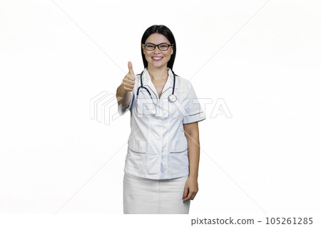 Happy asian female doctor giving a thumb up. Isolated on white. Happy asian female doctor giving a thumb up. Isolated on white. 105261285