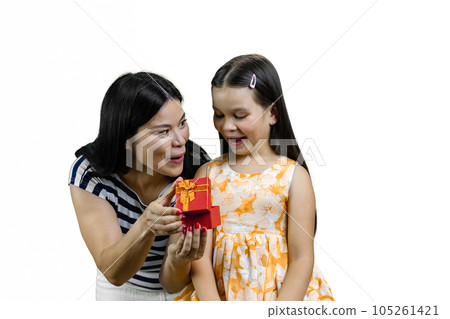 Young asian mother with her little daughter open a red gift box together. Isolated on white. 105261421