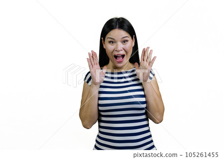 Portrait of a young screaming yelling asian woman. Isolated on white. 105261455