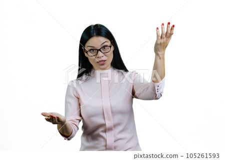 Portrait of a young asian businesswoman is explaining something and gesturing. Isolated on white. Portrait of a young asian businesswoman is explaining something and gesturing. Isolated on white. 105261593