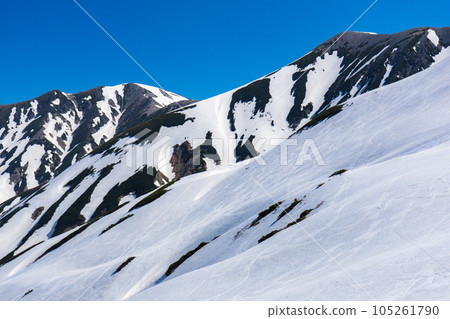 Climbing the Tateyama Mountains in the Northern Alps during the remaining snow season Mt. Masago over Yamazaki Cirque Climbing the Tateyama Mountains in the Northern Alps during the remaining snow season Mt. Masago over Yamazaki Cirque 105261790