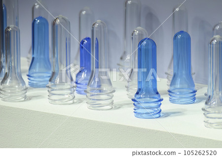Close up scene of group of preform shape of PET bottle products. Close up scene of group of preform shape of PET bottle products. 105262520