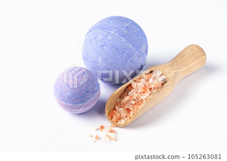 Purple bath bombs and bath sea salt on white background. Healthy beauty spa products. Aromatherapy and herbal medicine for body care and antistress. 105263081