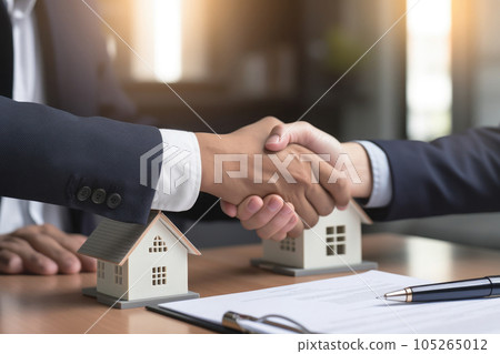 Handshaking between real estate agent and client in office. Generative AI Handshaking between real estate agent and client in office. Generative AI 105265012