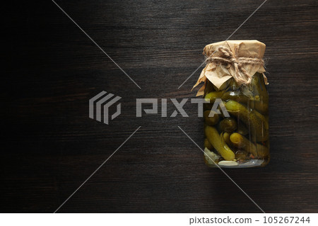 Tasty canned food concept, canned cucumbers, food for winter Tasty canned food concept, canned cucumbers, food for winter 105267244