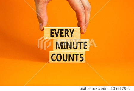 Every minute counts symbol. Concept words Every minute counts on wooden blocks on a beautiful orange table orange background. Businessman hand. Business, motivational and every minute counts concept. 105267962