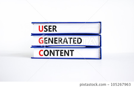 UGC user generated content symbol. Concept words UGC user generated content on books on a beautiful white table white background. Business and UGC user generated content concept. Copy space. 105267963