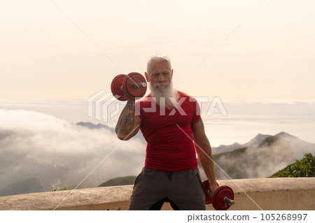 Senior man doing sport exercises Senior man doing sport exercises 105268997