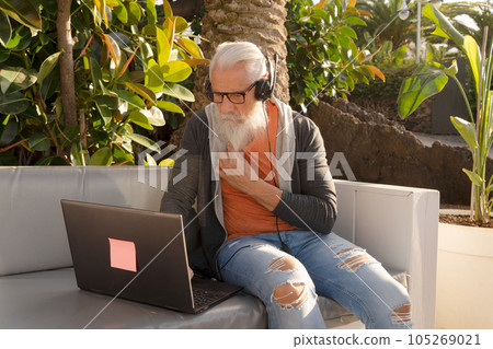 Senior man working with laptop Senior man working with laptop 105269021