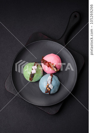 Delicious sweet colorful mochi desserts or ice cream with rice dough and toppings 105269266