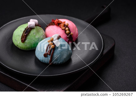 Delicious sweet colorful mochi desserts or ice cream with rice dough and toppings 105269267