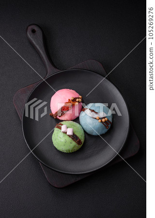 Delicious sweet colorful mochi desserts or ice cream with rice dough and toppings 105269276