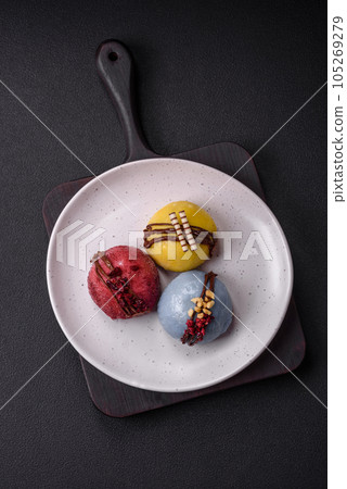 Delicious sweet colorful mochi desserts or ice cream with rice dough and toppings 105269279
