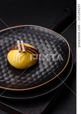 Delicious sweet colorful mochi desserts or ice cream with rice dough and toppings Delicious sweet colorful mochi desserts or ice cream with rice dough and toppings 105269297