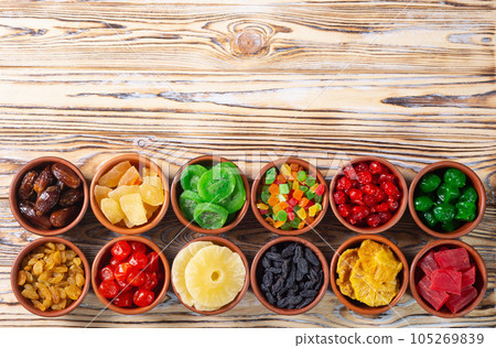 Group of dried and candied fruit in bowl Group of dried and candied fruit in bowl 105269839