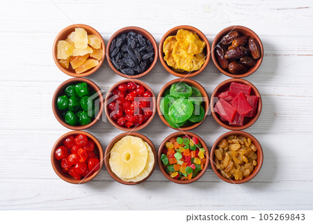 Group of dried and candied fruit in bowl 105269843