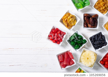 Group of dried and candied fruit in bowl 105269856