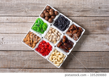 Mix of dried and candied fruits and nuts 105269860