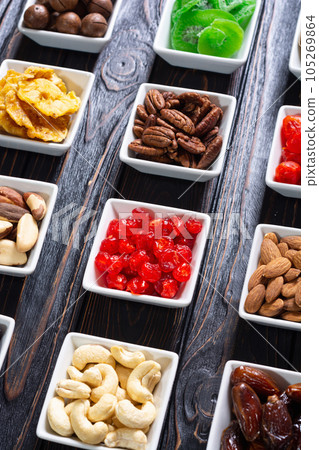 Mix of dried and candied fruits and nuts 105269864