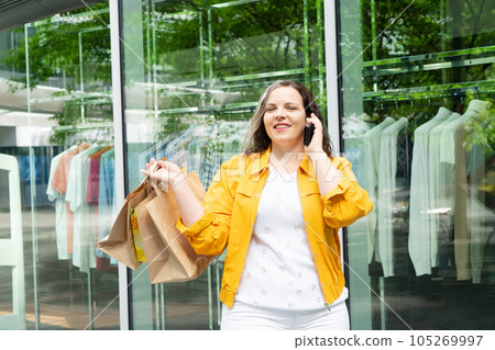 Happy woman shopping 105269997