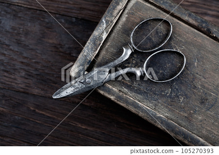 Antique wooden box and old vintage retro scissors. 105270393