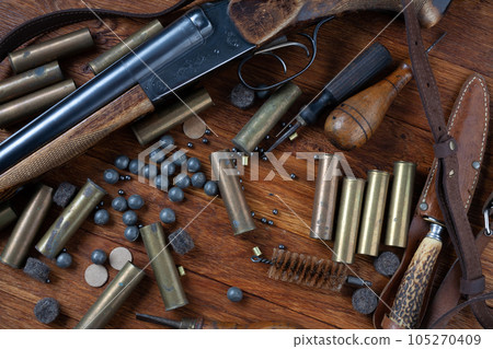 Hunting shotgun with brass cases and accessories for cartridge reloading. Hunting shotgun with brass cases and accessories for cartridge reloading. 105270409
